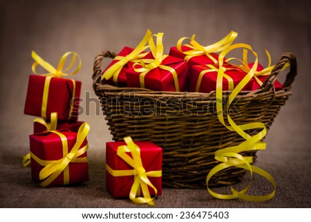 basket full of red wrapped gifts
