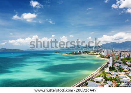 Beautiful view on Nha Trang and Nha Trang Bay of South China Sea with magic colors of water on blue sky background in Khanh Hoa province, Vietnam. Nha Trang is a popular tourist destination of Asia.