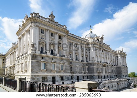 The north facade of the Royal Palace of Madrid on the blue sky background in Spain. Madrid is a popular tourist destination of Europe.