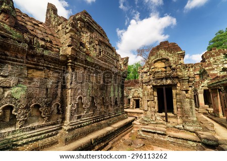 Wall with bas-relief of ancient Preah Khan temple in enigmatic Angkor, Siem Reap, Cambodia. Mysterious Angkor is a popular tourist attraction.