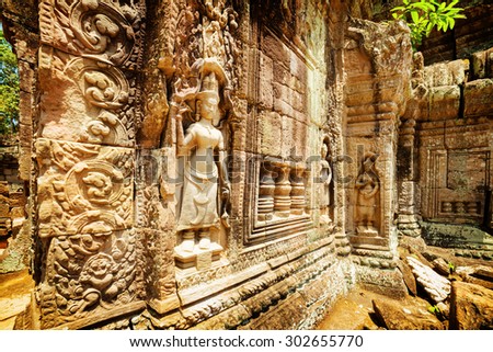 Wall with bas-relief of ancient Ta Som temple in amazing Angkor, Siem Reap, Cambodia. Enigmatic Angkor is a popular tourist attraction.