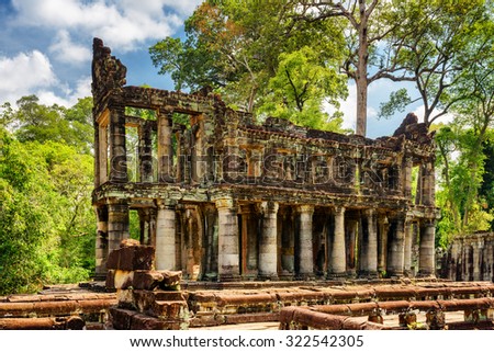 Mysterious ruins of ancient building with columns in Preah Khan temple, Angkor, Siem Reap, Cambodia. Enigmatic Preah Khan temple has been swallowed by jungle. It is a popular tourist attraction.