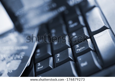 Close up shot of credit card and computer keyboard