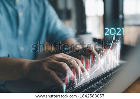 2021 business finance technology and investment concept. Stock Market Investments Funds and Digital Assets. businessman analysing forex trading graph financial data. Business finance background.