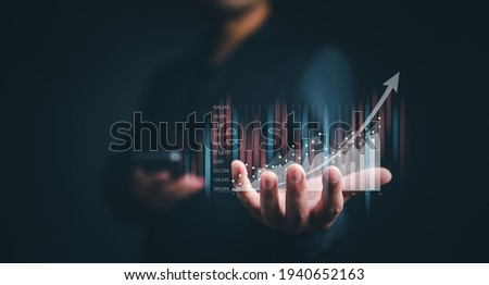 planning and strategy, Stock market, Business growth, progress or success concept. Businessman or trader is showing a growing virtual hologram stock, invest in trading.