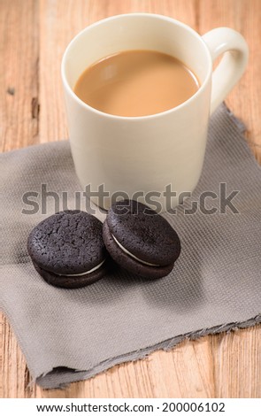 cup of coffee with soft cookie