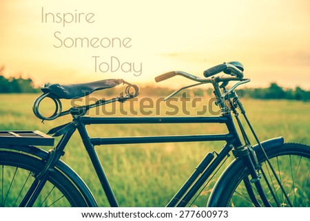 beautiful landscape image with Bicycle at sunset in vintage tone style ; life quote. Inspirational quote. Motivational background