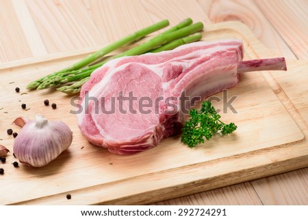 pork chop with garlic and asparagus and pastry for make a steak