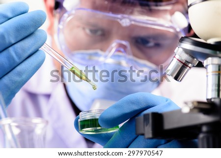 Conical flask in scientist hand with lab glassware background, Laboratory research concept