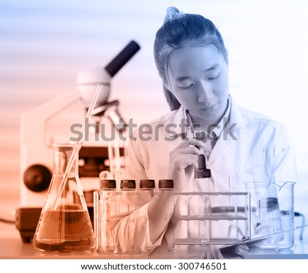 female medical or scientific researcher or woman doctor thinking for write report in a laboratory with her microscope beside her