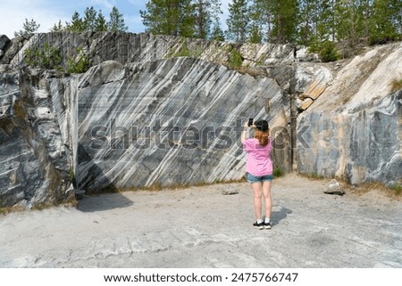 Similar – Image, Stock Photo Woman photographing rocky formations on smartphone