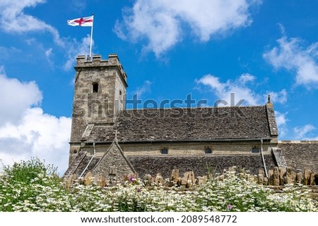 The 12th century St Mary’s Church, Swinbrook in The Cotswolds, England Stock fotó © 