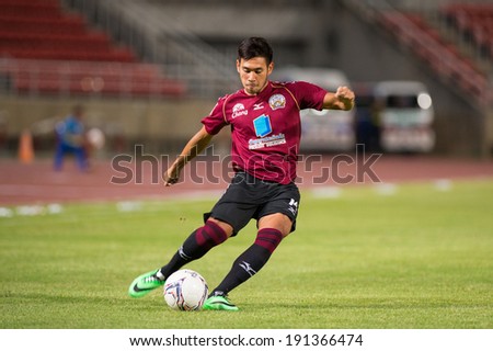 PATHUMTHANI THAILAND-MAY 05:Pakorn Prempak of Police Utd. hit the ball during   Thai Premier League match between Police Utd.and Songkhla Utd.at Thammasat Stadium on May 05,2014,Thailand