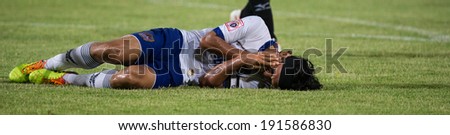 PATHUMTHANI THAILAND-MAY 05:Chairat Madsiri of Songkhla Utd. injury reacts during a Thai Premier League match between Police Utd.and Songkhla Utd.at Thammasat Stadium on May 05,2014,Thailand