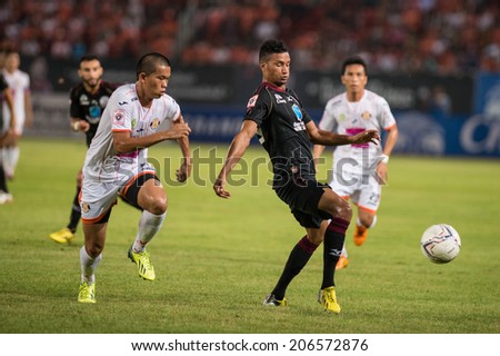 PATHUMTHANI THAILAND-Jul19:Michael Murcy(B)of Police Utd.contols the ball during the Thai Premier League between Police United and Sisaket FC at Thammasat Stadium on July19,2014,Thailand