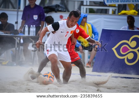 PHUKET THAILAND-NOV19:LE Kim Tuan(W)of Vietnam fights for the ball during the   Beach Soccer match between Oman and Vietnam the 2014 Asian Beach Games at Saphan Hin on November19,2014 in Thailand