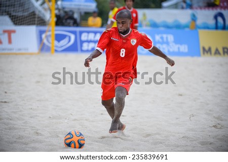 PHUKET THAILAND-NOV19:Yaqoob Rabia Al Alawi of Oman run with the ball during the Beach Soccer match between Oman and Vietnam the 2014 Asian Beach Games at Saphan Hin on November19,2014 in Thailand