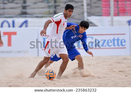 PHUKET THAI-NOV19:Mehdi Hassaninozari(W)of Iran compete for the ball during the Beach Soccer match between Iran and Thailand the 2014 Asian Beach Games at Saphan Hin on November19,2014 in Thailand