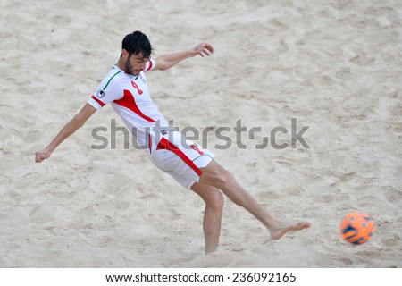 PHUKET THAI-NOV19:Amir Hosein Akbari Fartkhouni of Iran kicks the ball during the Beach Soccer match between Iran and Thailand the 2014 Asian Beach Games at Saphan Hin on November19,2014 in Thailand
