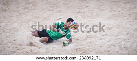 PHUKET THAILAND-NOV19:Goalkeeper Hamid Behzadpour of Iran makes a save during the  Beach Soccer match between Iran and Thailand the 2014 Asian Beach Games at Saphan Hin on November19,2014 in Thailand