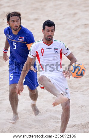 PHUKET THAILAND-NOV19:Mohammadali Mokhtari#9 of Iran kicks the ball during the Beach Soccer match between Iran and Thailand the 2014 Asian Beach Games at Saphan Hin on November19,2014 in Thailand