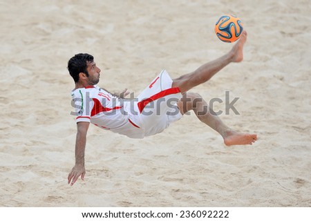 PHUKET THAILAND-NOV19:Mohammad Ahmadzadeh of Iran kicks the ball during the Beach Soccer match between Iran and Thailand the 2014 Asian Beach Games at Saphan Hin on November19,2014 in Thailand