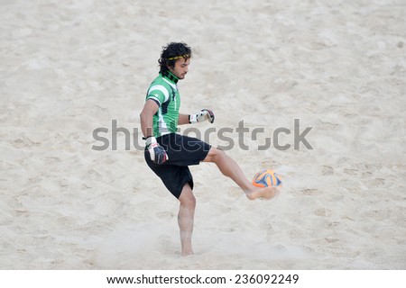 PHUKET THAI-NOV19:Goalkeeper Seyedpeyman Hosseinilargani of Iran kicks during the Beach Soccer match between Iran and Thailand the 2014 Asian Beach Games at Saphan Hin on November19,2014 in Thailand