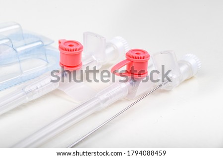 Medicinal venflon for the administration of intravenous fluids. Medical accessories needed in intensive care. Light background. Foto stock © 
