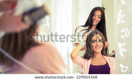 Hairdresser doing haircut for women in hairdressing salon. Concept of fashion and beauty. Positive emotion.