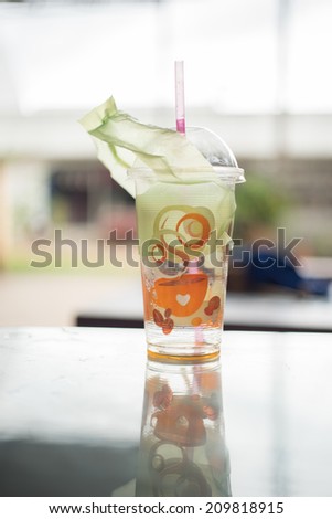 empty plastic glass with coffee cup pattern,take-home cup of ice coffee