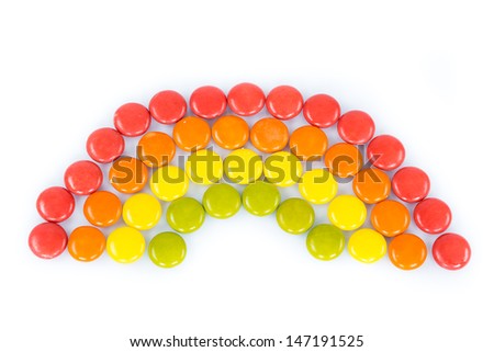 Colorful candies in raindow colors and shape