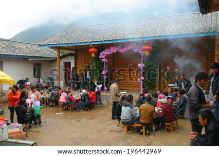 LIJIANG, CHINA - SEPTEMBER 19: Unidentified Mosuo Minority People attend a wedding ceremony and wedding feast, September 19, 2013, Linlang, Lijiang,Yunnan, China