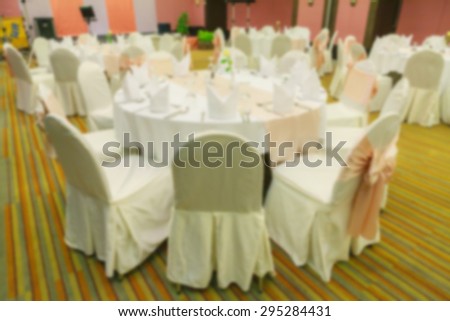 Blurred dining table in the banquet hall made with vintage color.