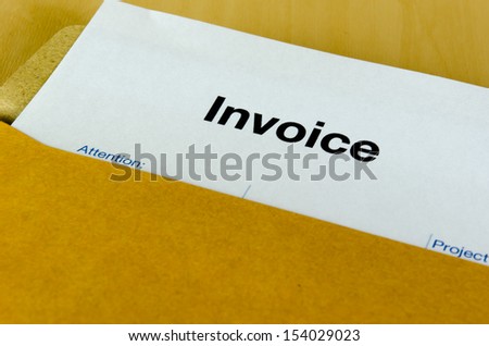 Billing invoice in the envelope on the table.