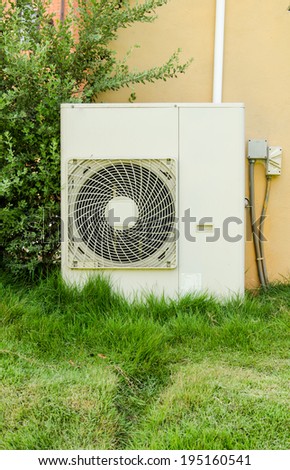 air conditioners installation outside on the lawn