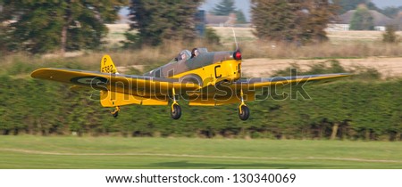 SHUTTLEWORTH, BEDFORDSHIRE, UK - OCTOBER 7: Miles M.14A Hawk Trainer P6382 landing on October 7, 2012 at the Shuttleworth Air Display in Shuttleworth, Old Warden Park, Bedfordshire, UK.