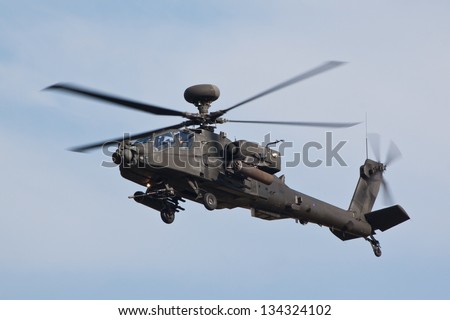 DUXFORD, CAMBRIDGESHIRE, UK - SEPTEMBER 3: Apache AH-64 flying on September 3, 2011 the  air display at Duxford, Cambridgeshire, UK.