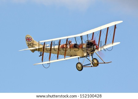 WOBURN ABBEY, BEDFORDSHIRE, UK - AUGUST 18: Royal Aircraft Factory BE.2c replica flying on August 18, 2013 at the De Havilland Moth Rally, Woburn Abbey, Bedfordshire, UK.
