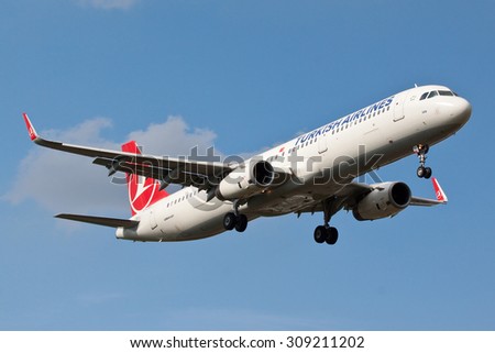 BIRMINGHAM, UK - AUGUST 22: Turkish Airlines Airbus A321 passenger plane (TC-JSH) landing on August 22, 2015 at Birmingham Airport, Birmingham, UK.