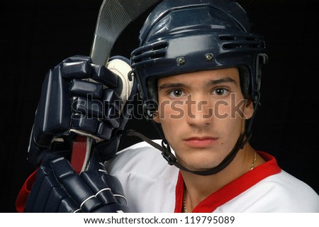 Male Hockey Player With Helmet, Stick And Gloves