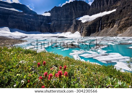 Stunning turquoise colored water at the base of Grinnell Glacier in Glacier National Park, Montana