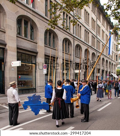 Zurich, Switzerland - 1 August, 2014: Swiss National Day parade participants. The Swiss National Day (German: Schweizer Bundesfeier) is the national holiday of Switzerland, celebrated on 1 August.