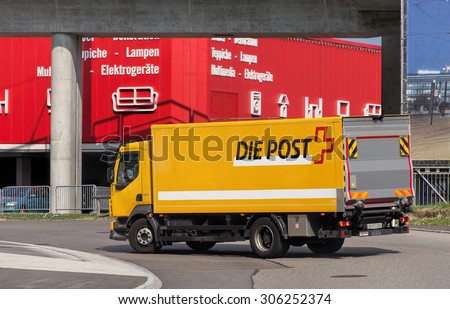 Wallisellen, Switzerland - 11 August, 2015: a Swiss Post truck on the road. Swiss Post is a public company owned by the Swiss Confederation providing the postal service of Switzerland.