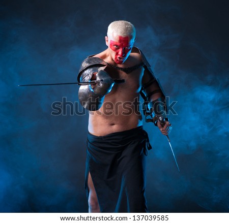 Knight with a sword on a blue smoky  background