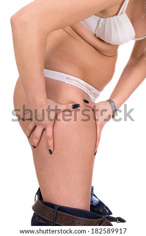 Plus size woman checking skin condition. Cellulite