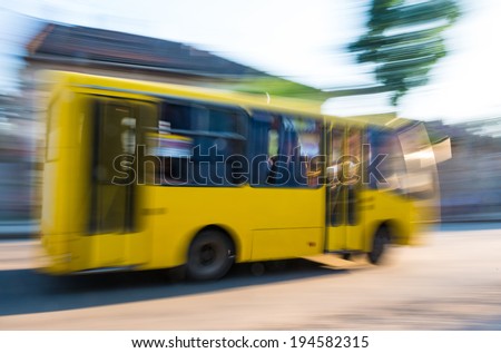 Driving bus in city traffic in motion blur