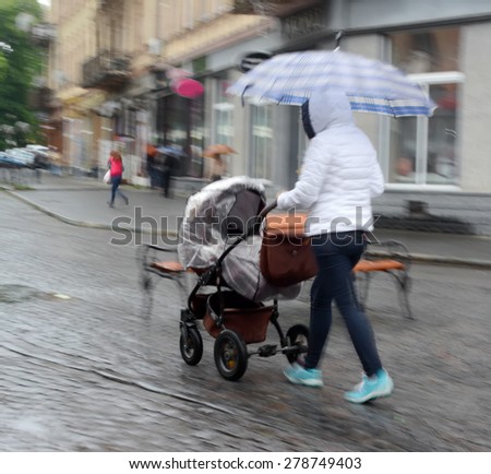 Similar – Image, Stock Photo Stroller in the rain with umbrella