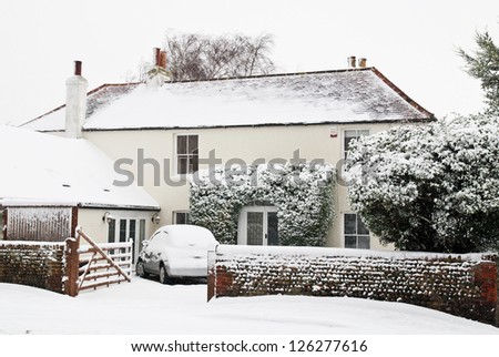 PAGHAM, WEST SUSSEX, ENGLAND JANUARY 18: Private house is covered in snow on January 18 2013 in Pagham. The first proper snow fall of the year covers much of the south east of England.