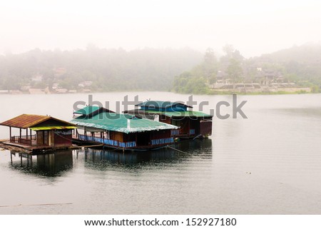 flooding house on the lake with the morning fog