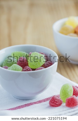 Gummy candies on wooden table